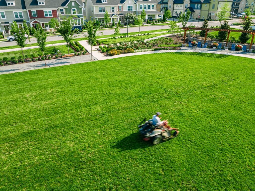 Established green lawn being maintained at a community property