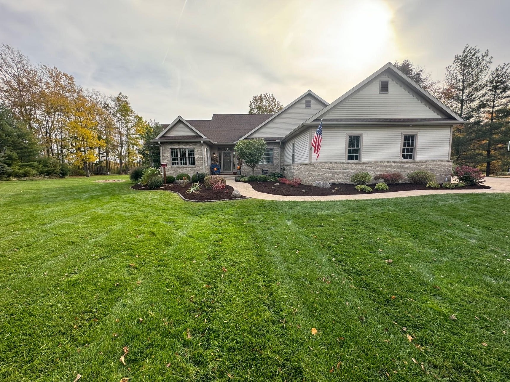Suburban home with manicured striped lawn
