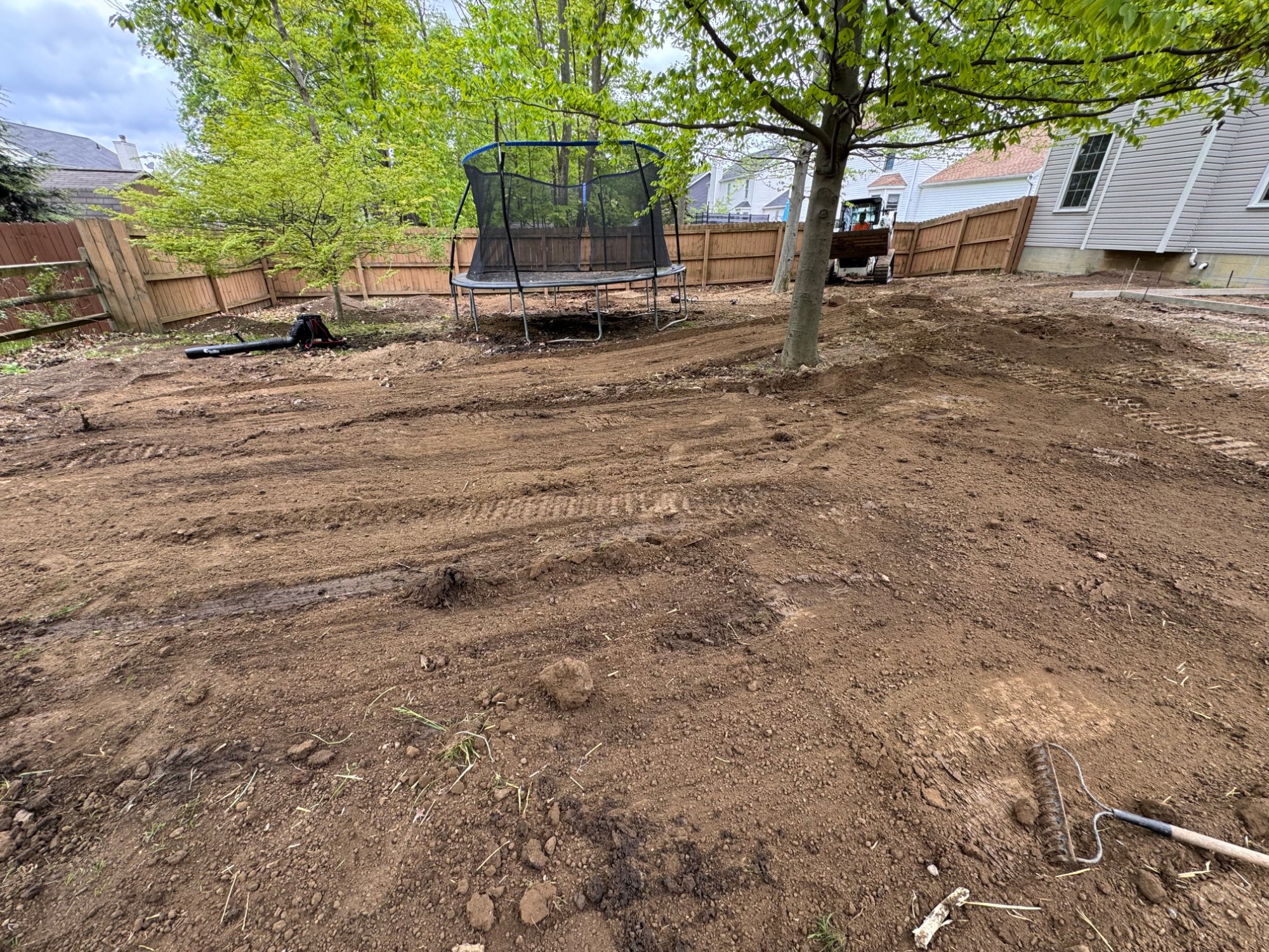 Backyard with freshly tilled and cleared soil