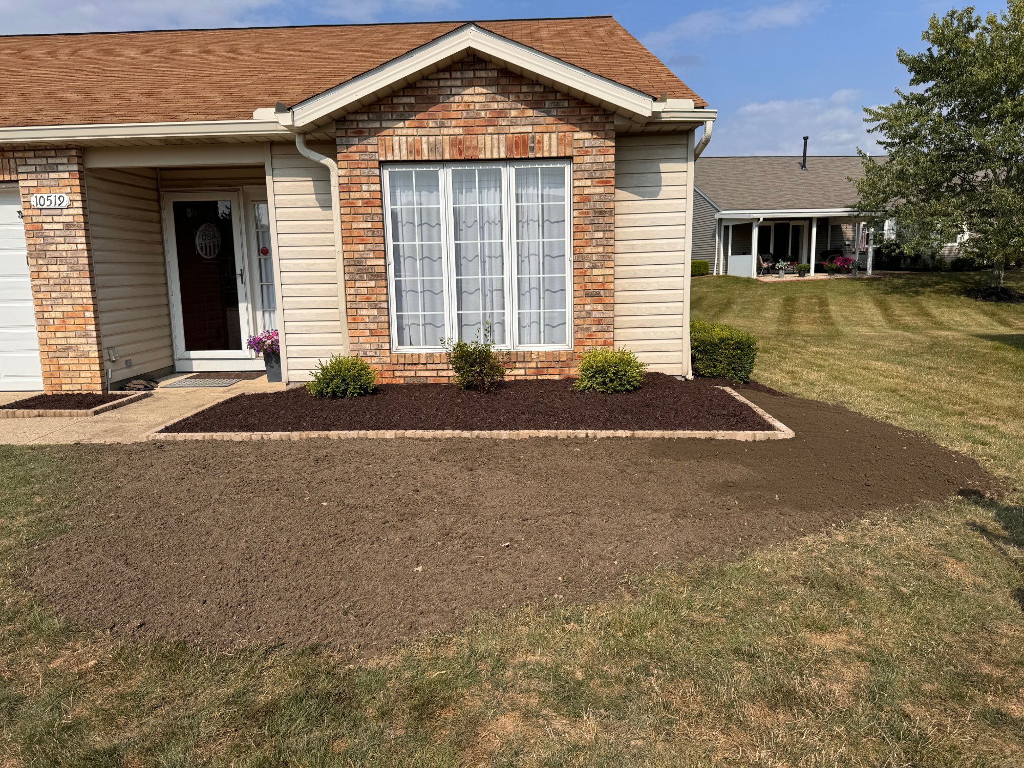Front yard soil prepared and graded for new lawn