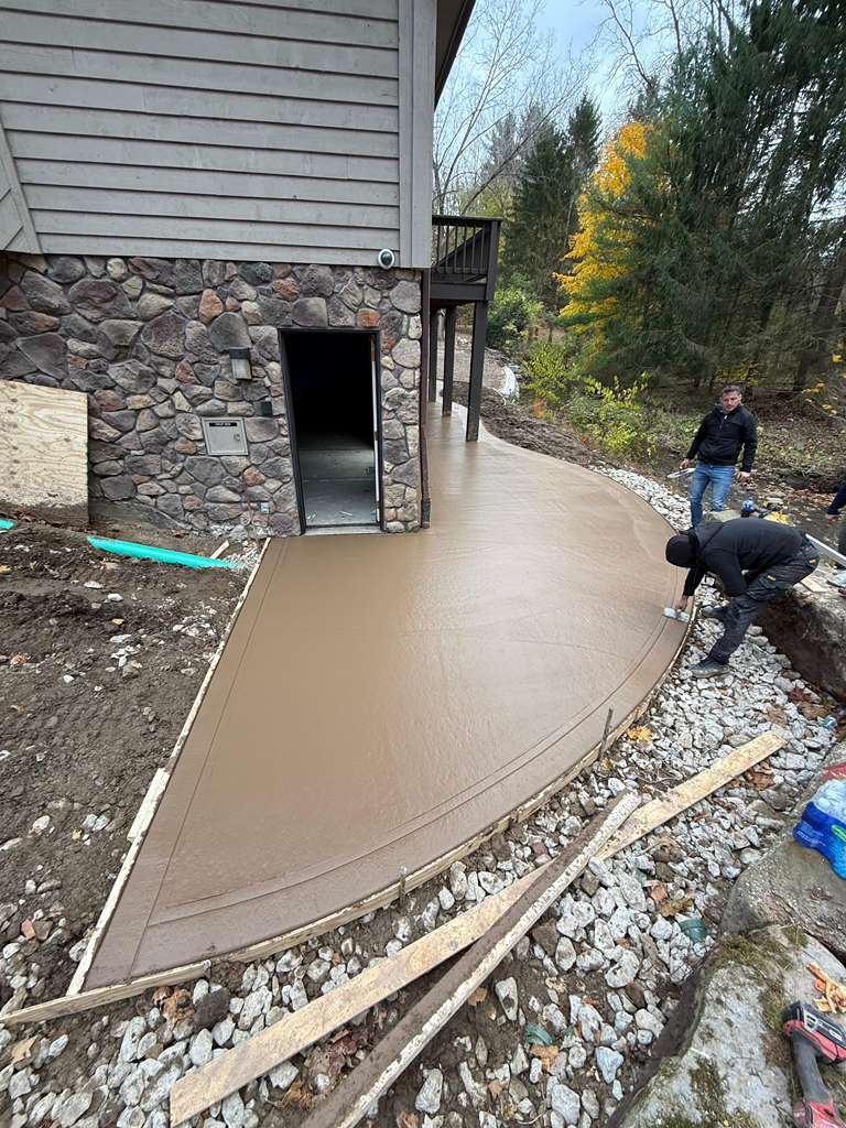 Paver walkway under construction, bedding sand screeded